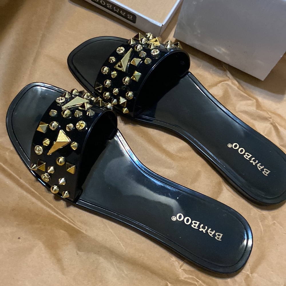 Black jelly pvc sandals with gold studs